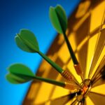 Three green darts hit the bullseye on a dartboard, symbolizing precision.